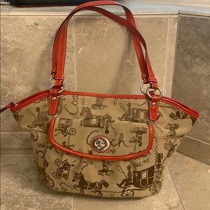 Coach shoulder bag brown with red leather detail.